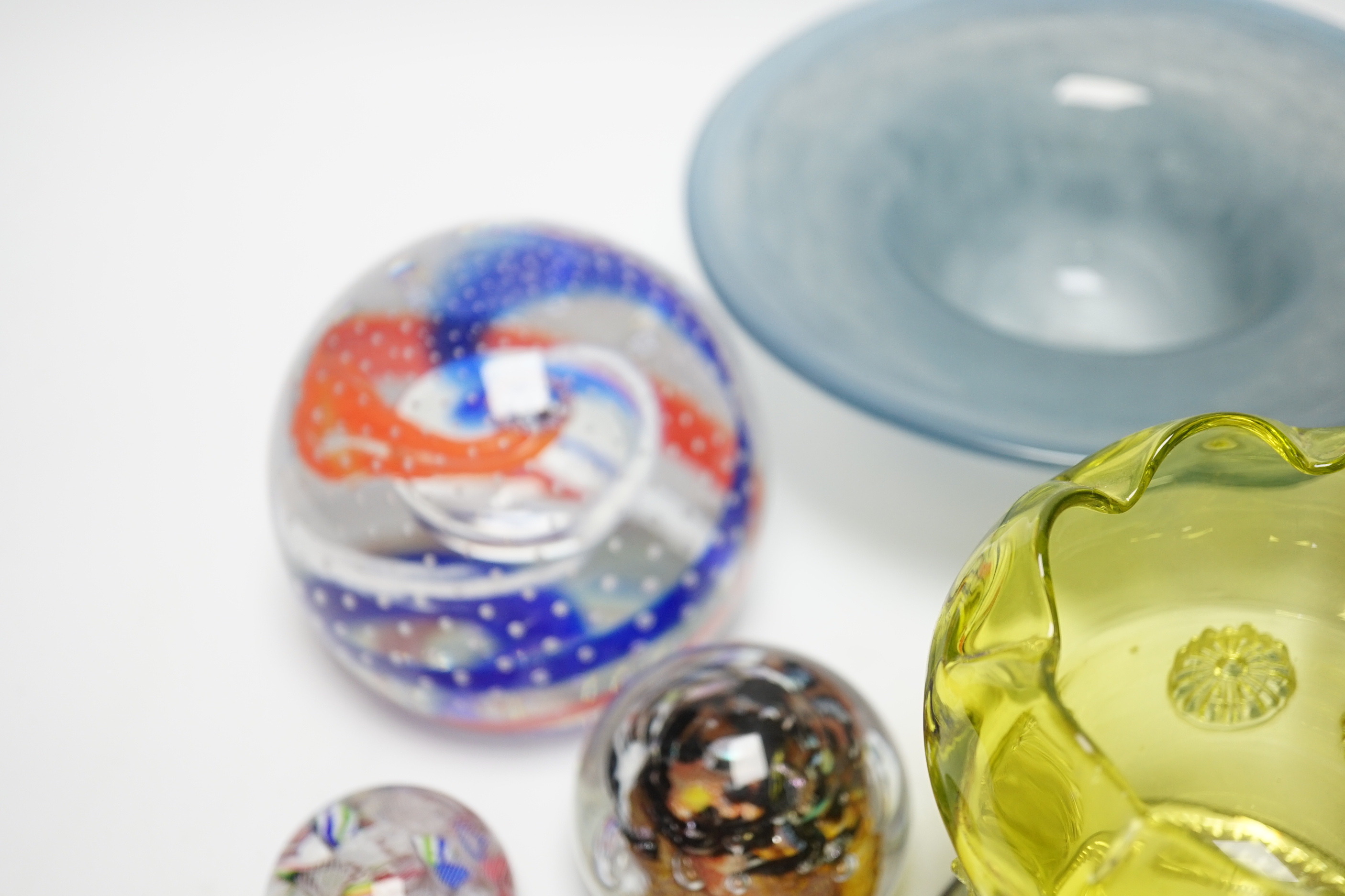 A group of mixed studio glass and a collection of four paperweights including one large Caithness